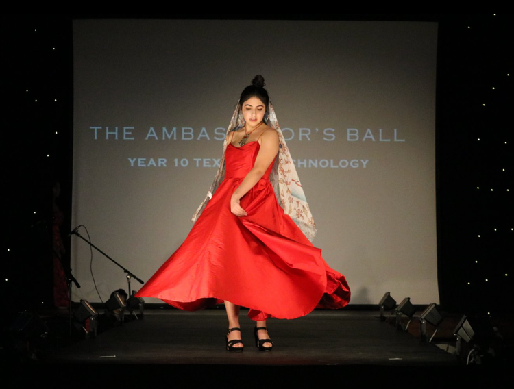 Student showcasing textiles product