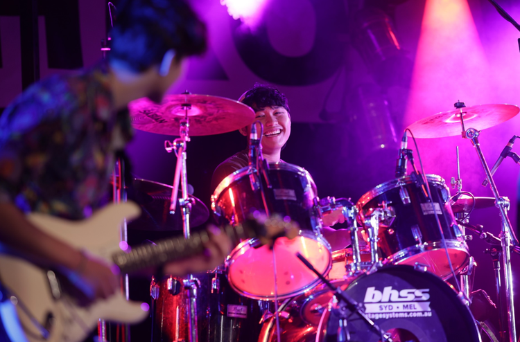 Student playing drums