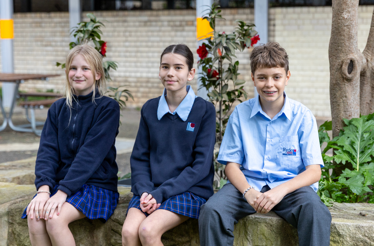 Students sitting in playground