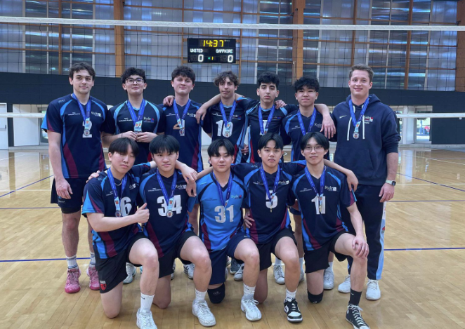 Volleyball team with teacher coach