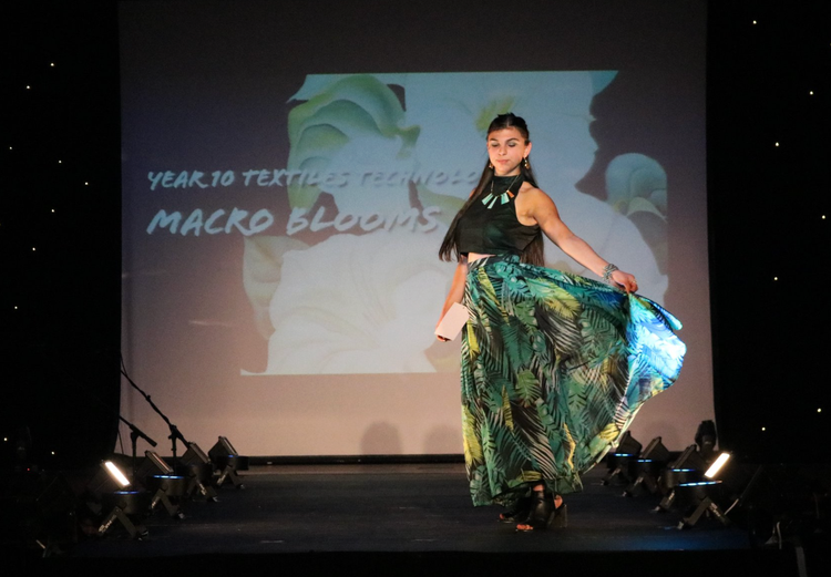 Student showcasing textiles product