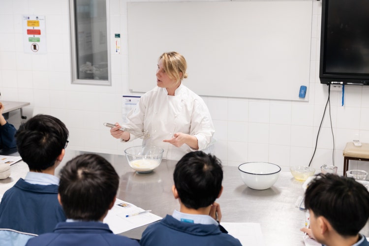 Teacher instructing food technology lesson