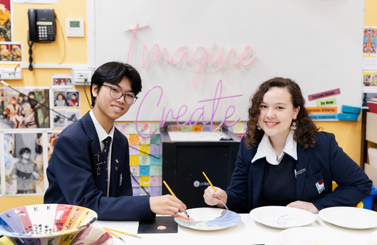 Students painting in class
