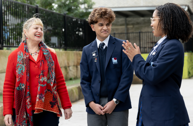 Students laughing with teacher
