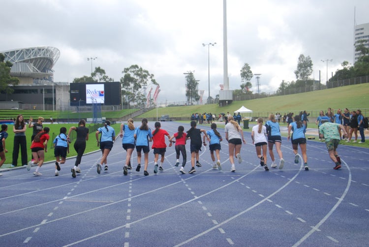 Students running on track