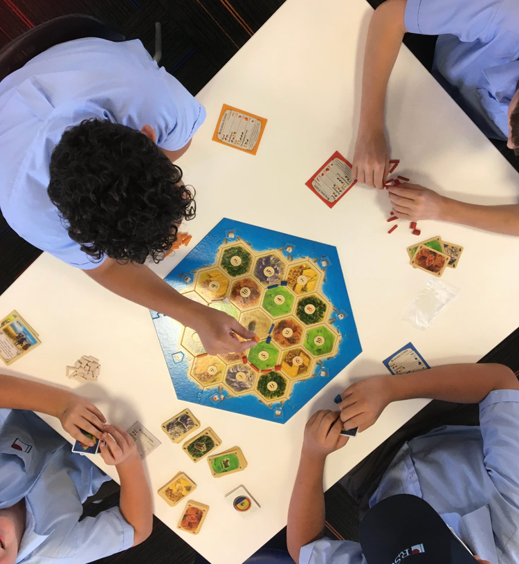Students playing board games