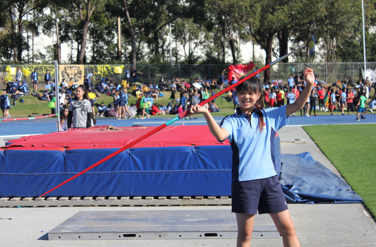 Student throwing javelin