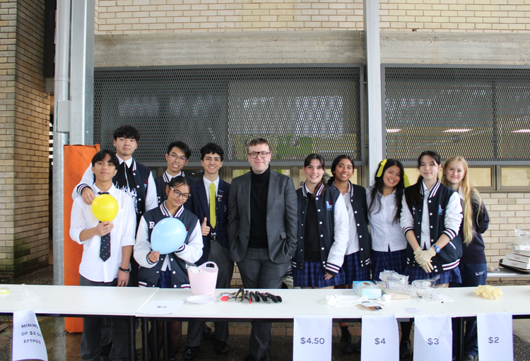 Students fundraising with teacher